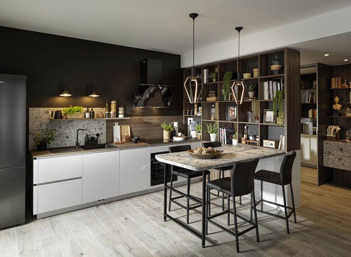 cuisine ouverte sur le salon, table en pierre, plan de travail terazzo et niches ouvertes pour séparer la cuisine de la rentrée